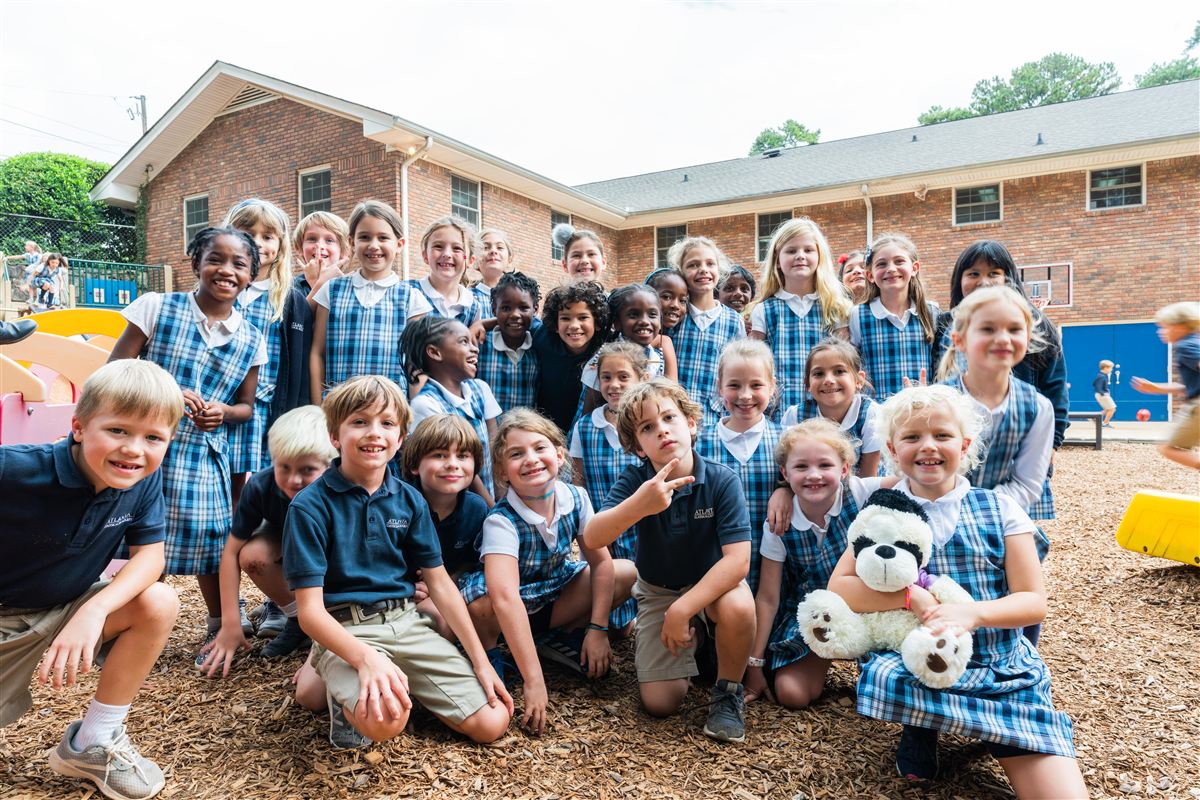 Group of students smiling outdoors at ACA